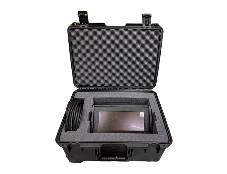 Open rugged protective case with foam padding housing a small portable display and a coiled cable inside the cutout in the foam.